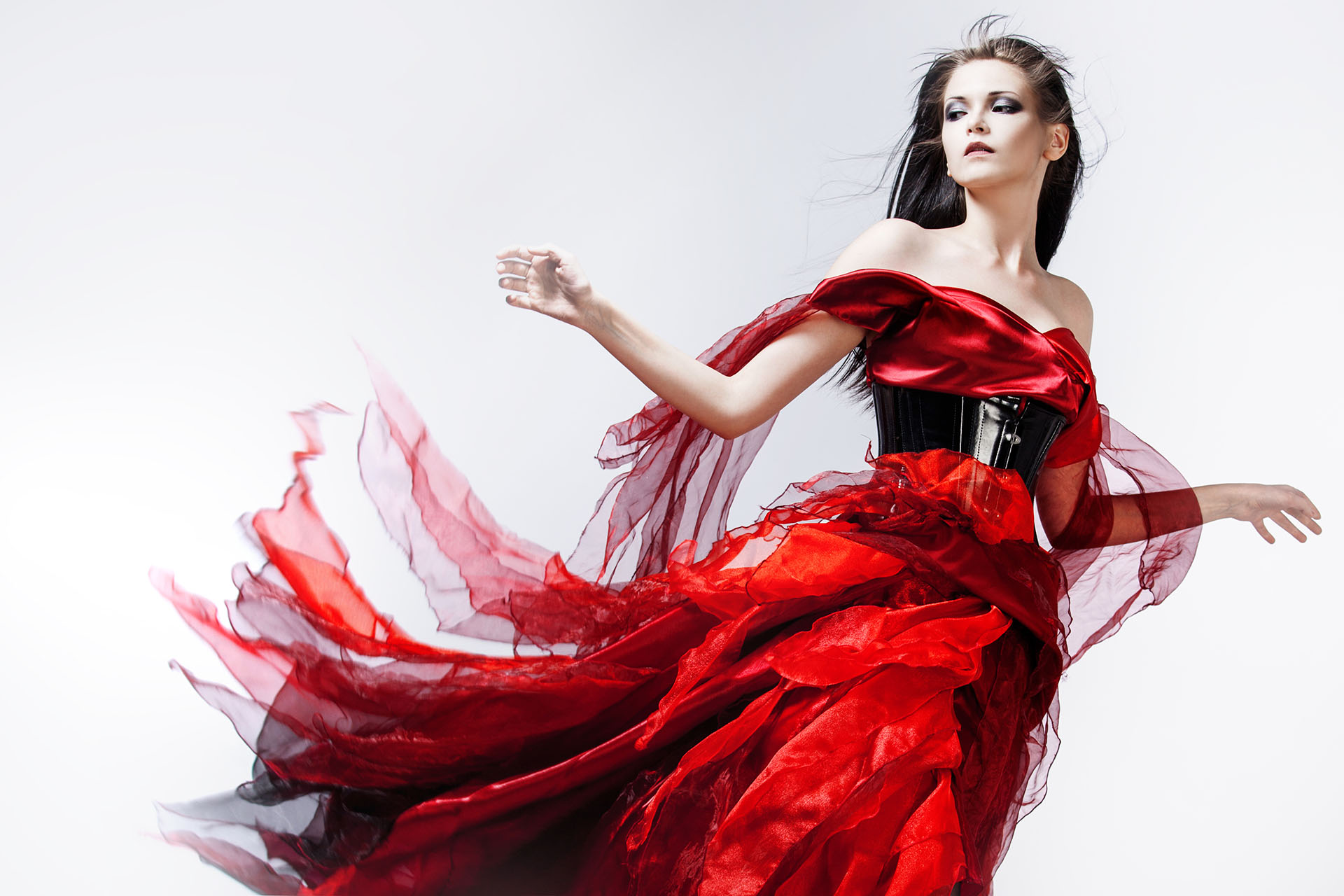 Fashion photo of young magnificent woman in red dress