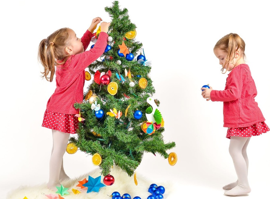 Children are decorating Christmas Tree