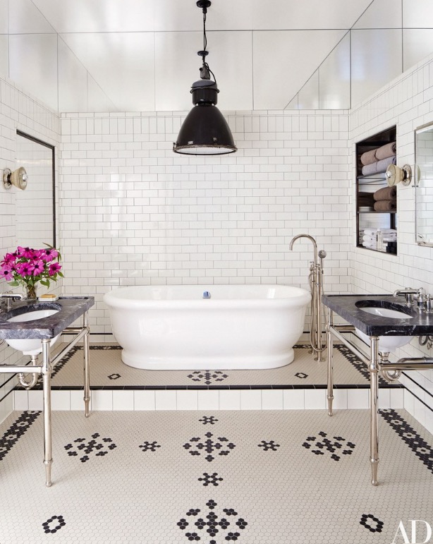 bathroom-features-a-raised-tub-and-subway-tiles-in-this-soho-apartment