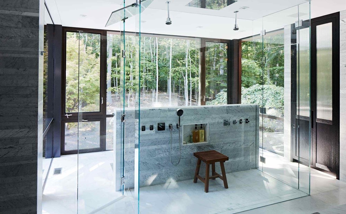 glass-enclosed-shower-cube-with-a-view-of-the-surrounding-woods-in-this-home-located-in-amagansett-n