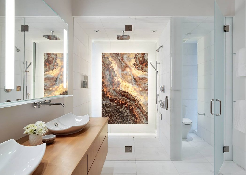 sleek-bathroom-featuring-a-stunning-onyx-panel-in-the-shower-in-this-home-in-teton-county-wyoming