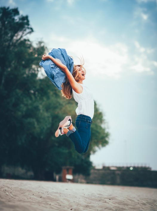 Young women joyfully jumping