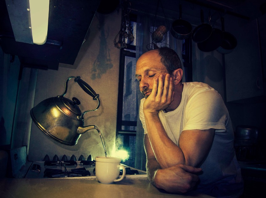 caucasian-man-pouring-cup-from-levitating-tea-kettle