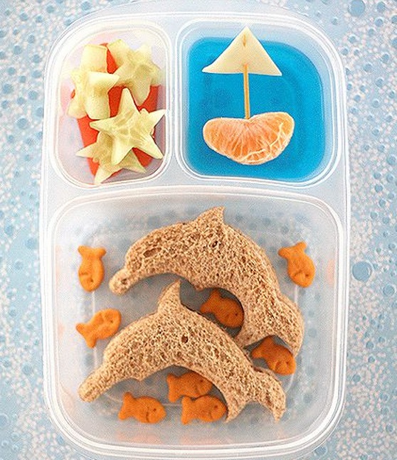 Dolphins, goldfish, starfish, and a boat