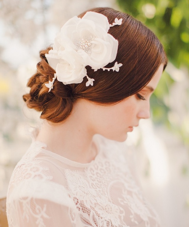 Ethereal low bun bridal upstyle with floral headpiece
