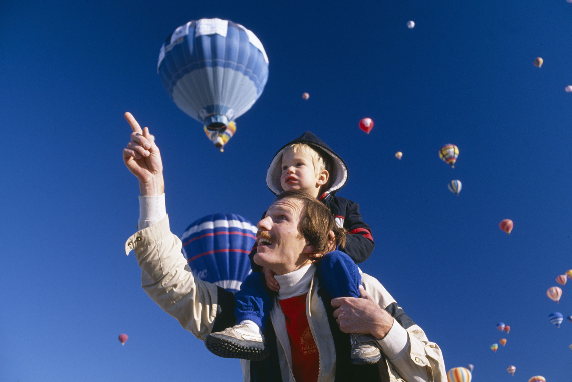 Father with young son on his shoulders, Albuquerque's Hot Air Balloon Festival, New Mexico