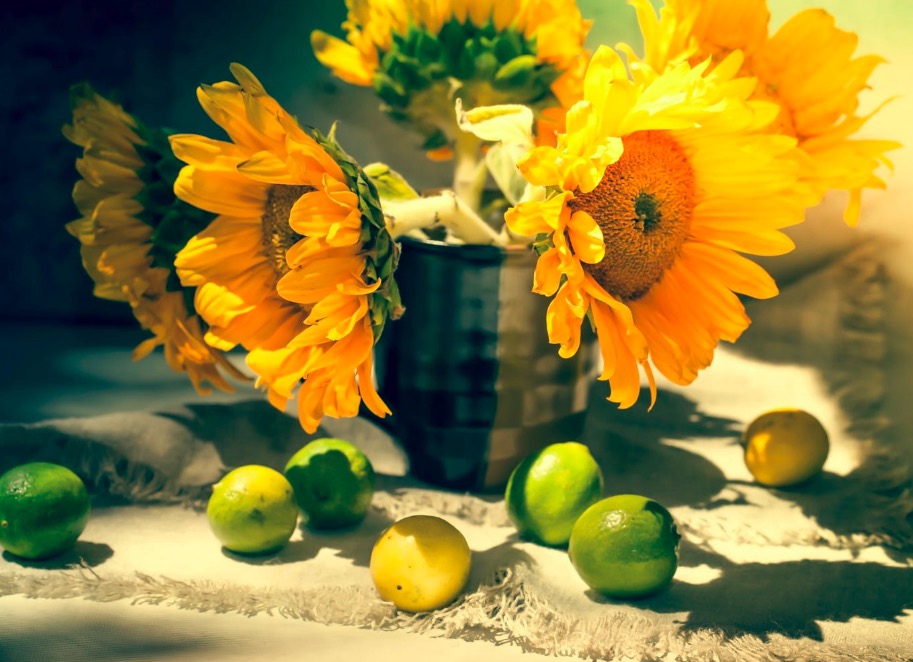 Still life with sunflowers and lemons