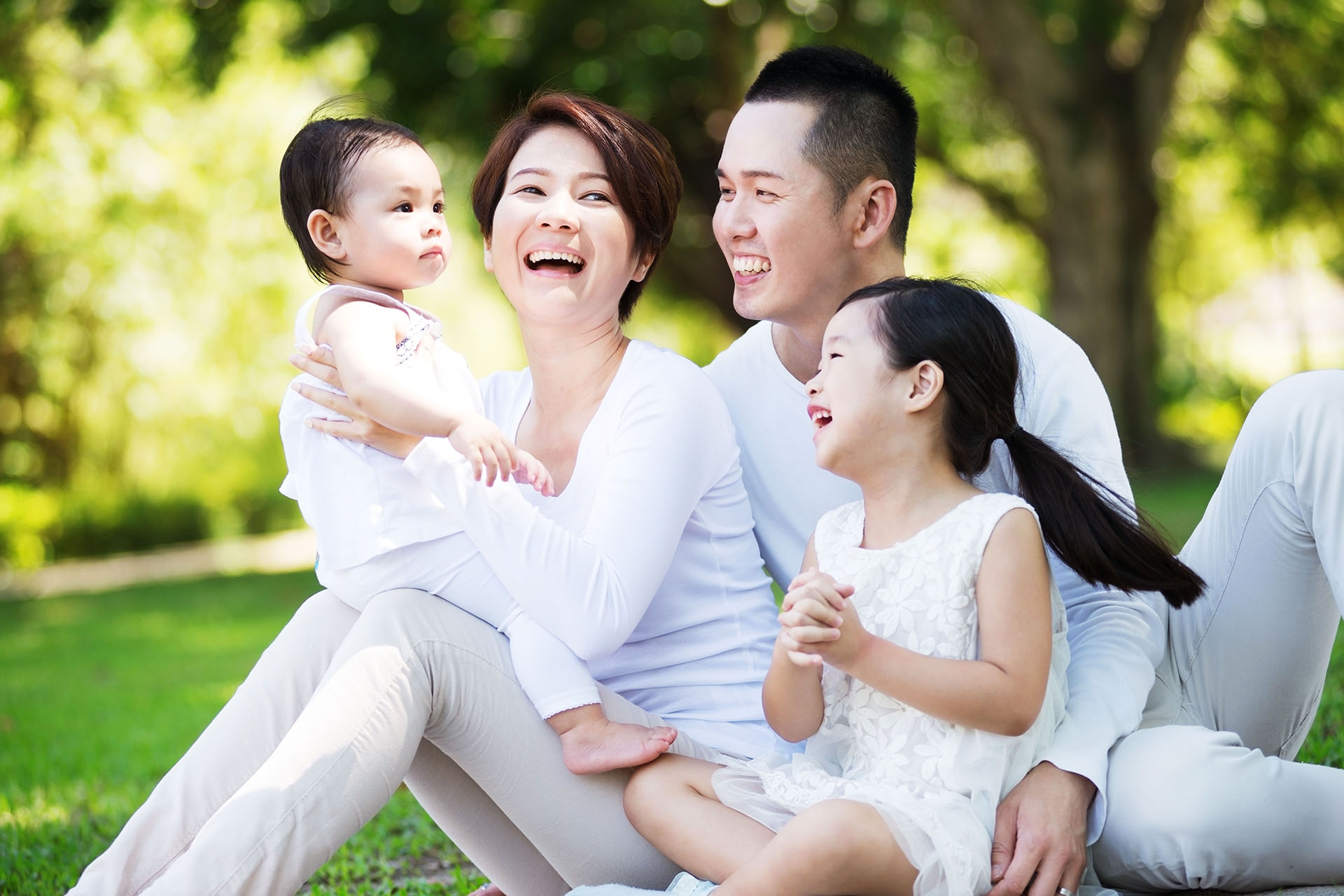 Young happy family spending time together at the park