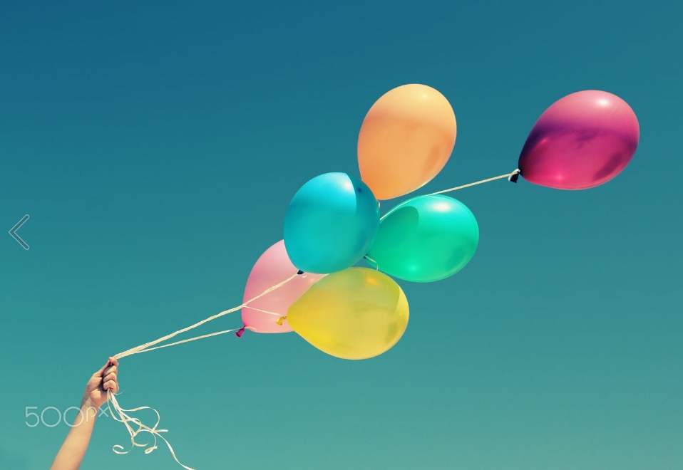 close up of colorful balloons