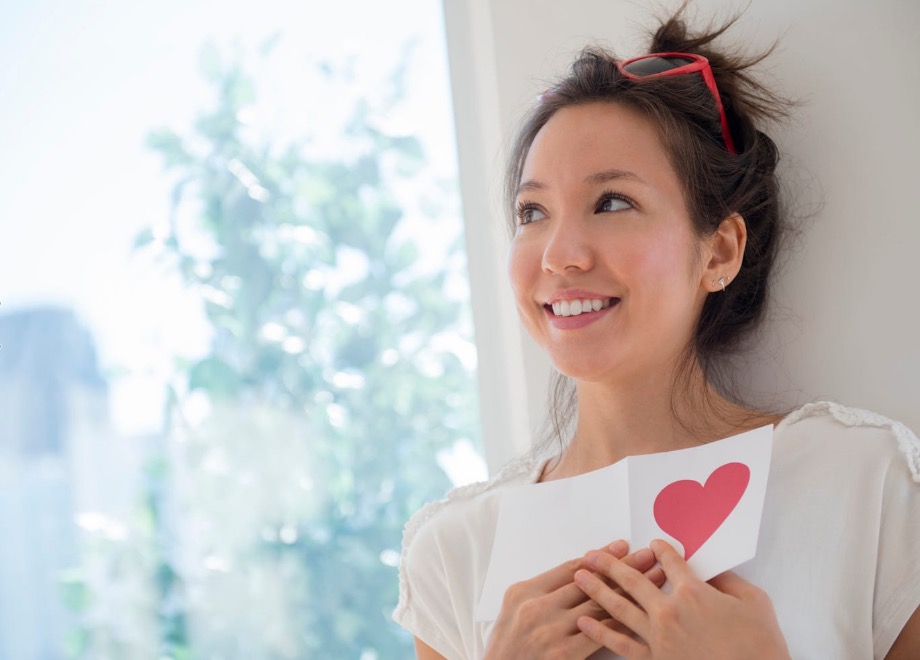 woman holding Valentine card