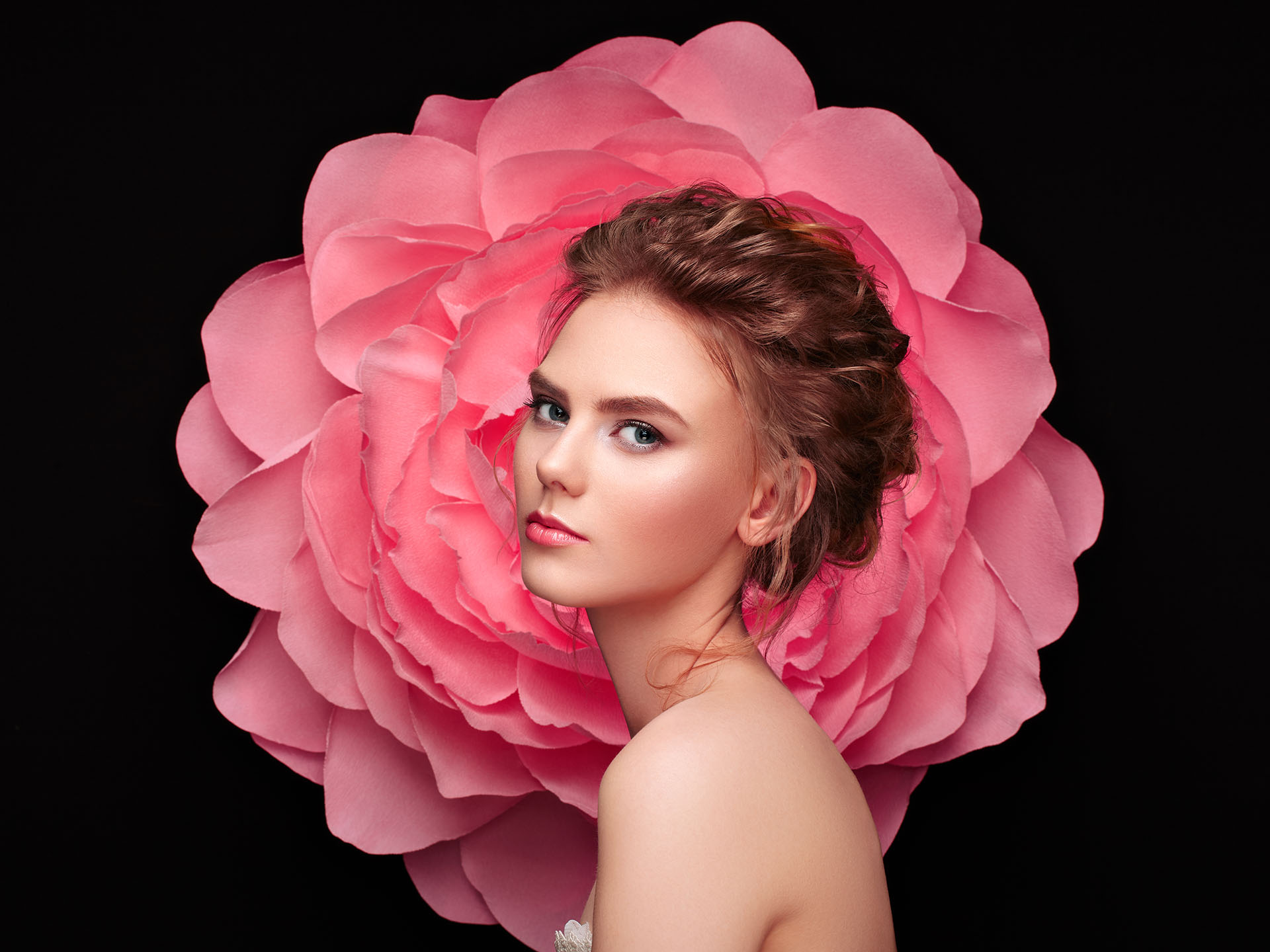 Beautiful woman on the background of a large flower