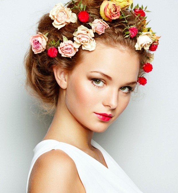 Beautiful woman with flowers perfect face