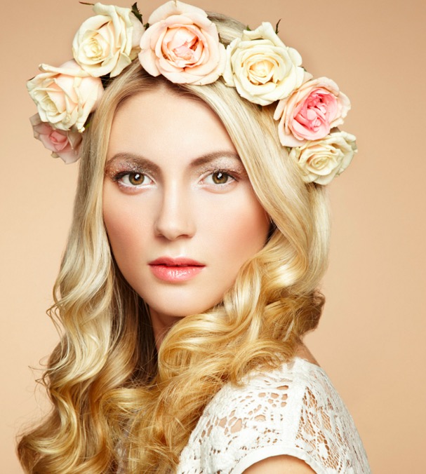 Portrait of a beautiful blonde woman with flowers in her hair
