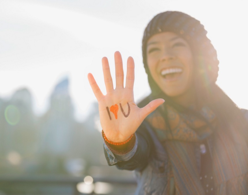 woman-showing-i-love-you-sign