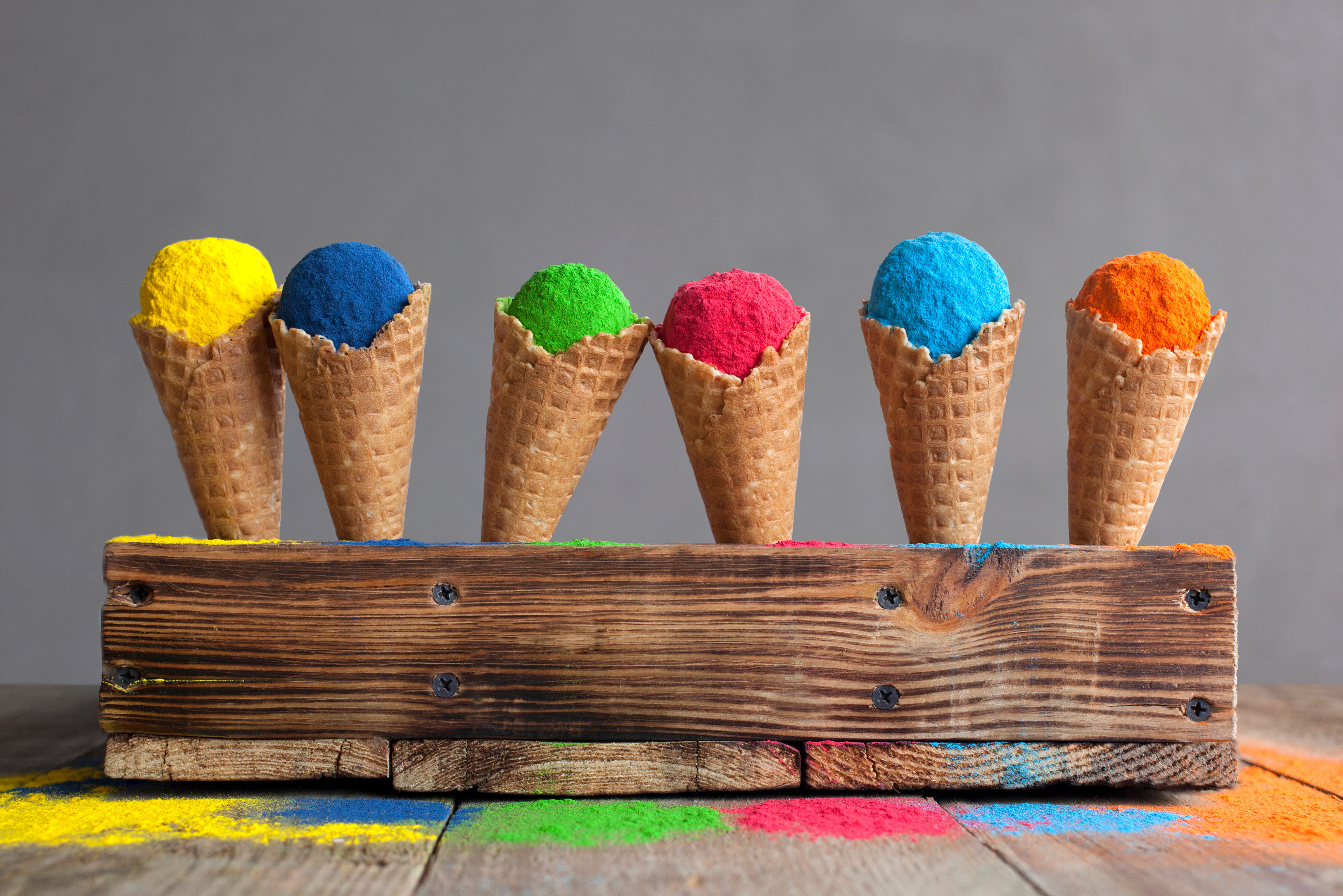 Bright colours in shapes of ice cream scoops in cones for Indian holi festival