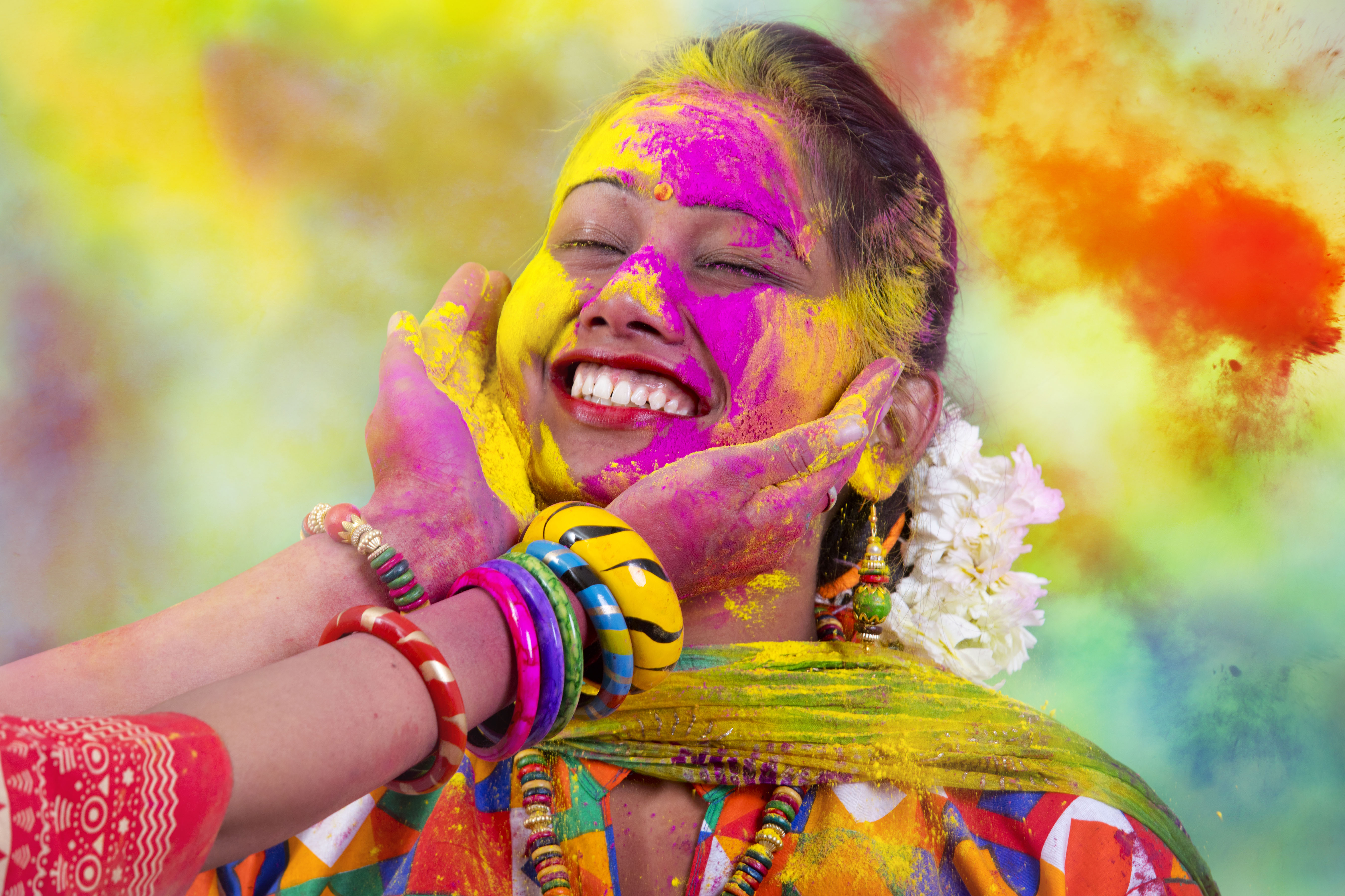 Portrait of young Indian Woman celebrating Holi color festival