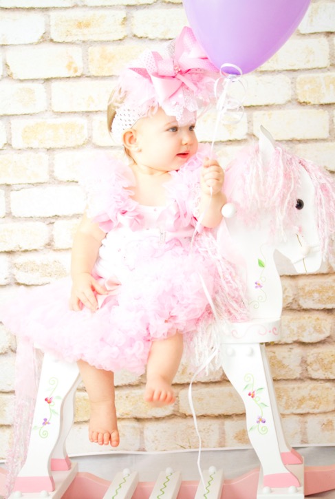 Cute pink doll on her horse