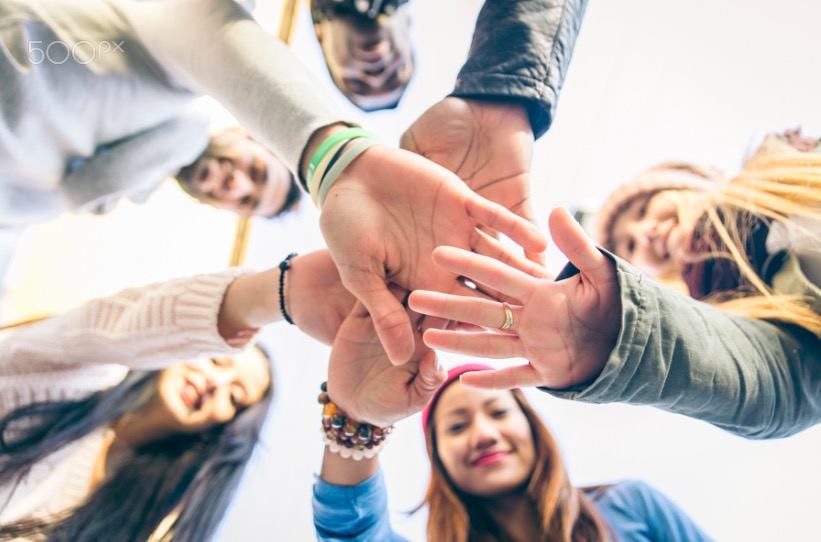 Group of people supporting each other