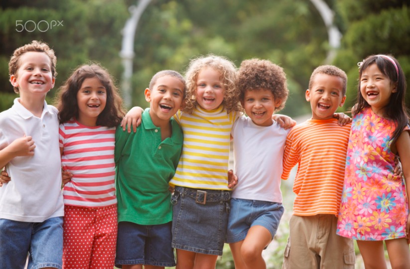 Portrait of children arm in arm