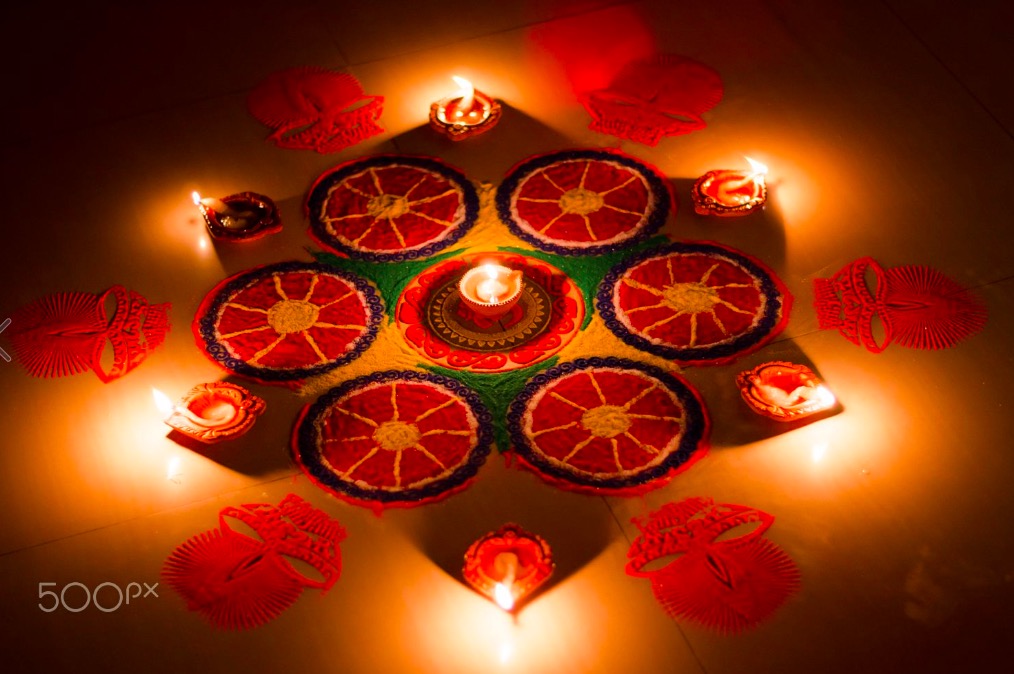 diwali-oil-lamps-at-night-on-rangoli-in-home