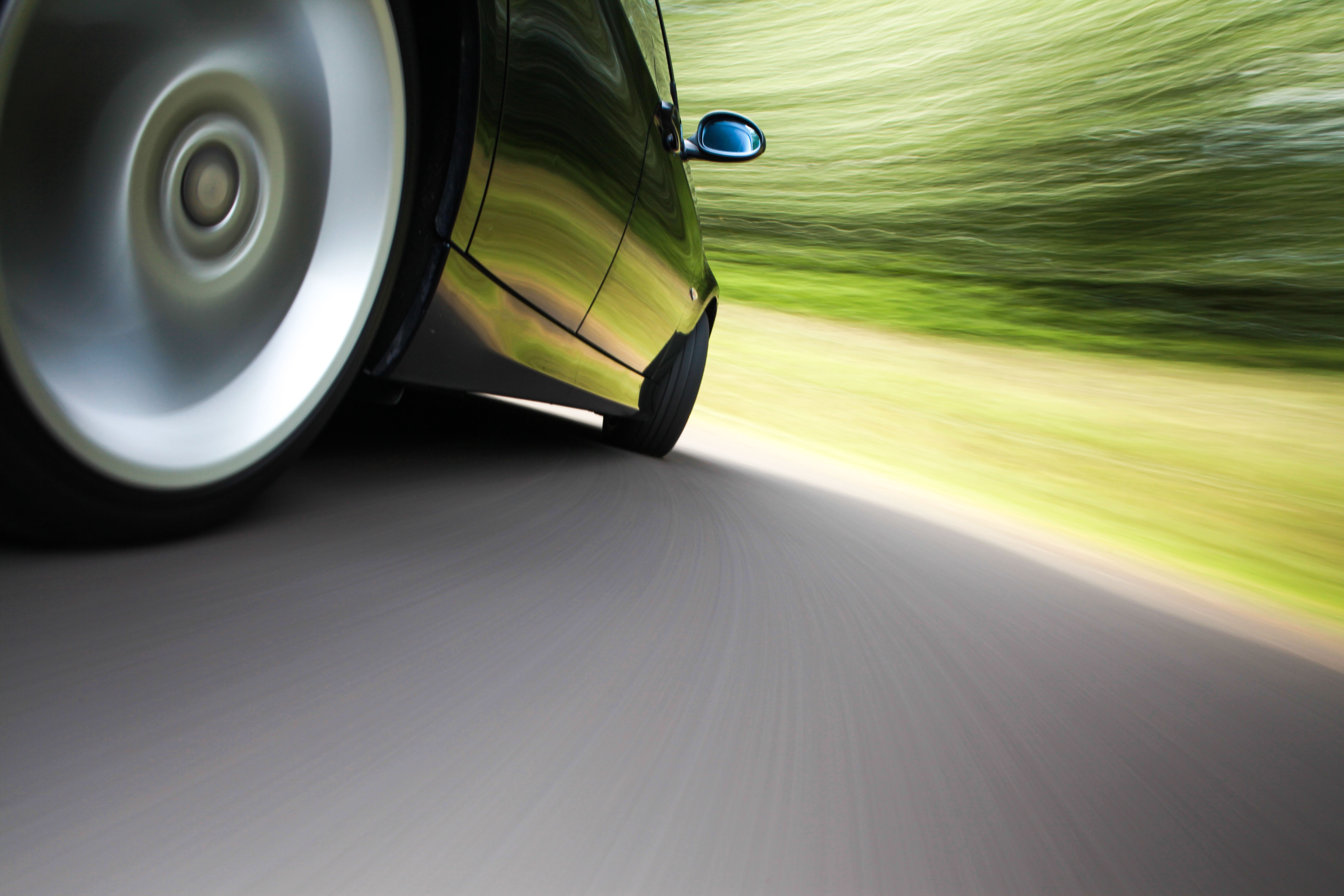 Rear side view of sport car in blurred motion