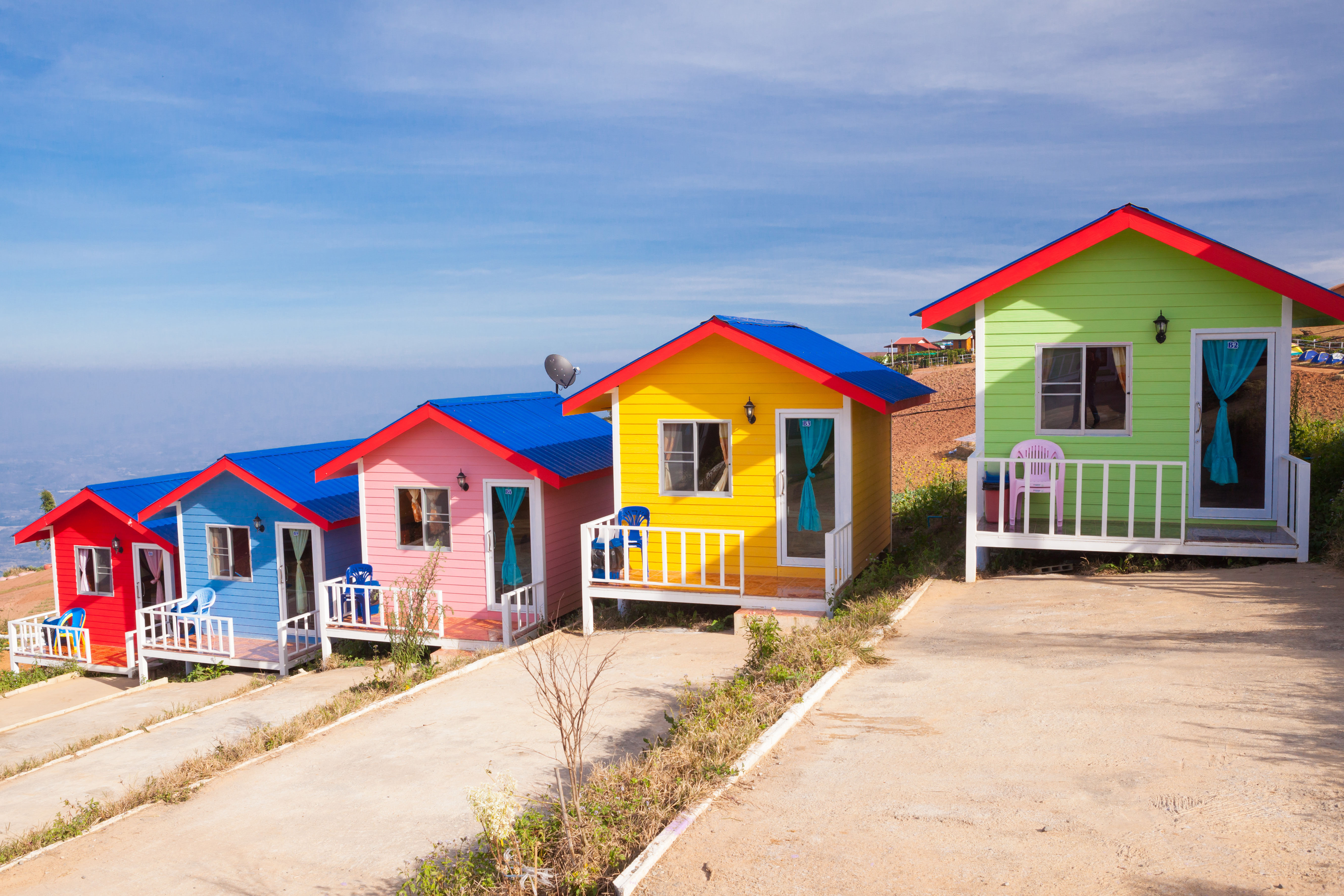 Colorful cabins on the mountain with blue sky