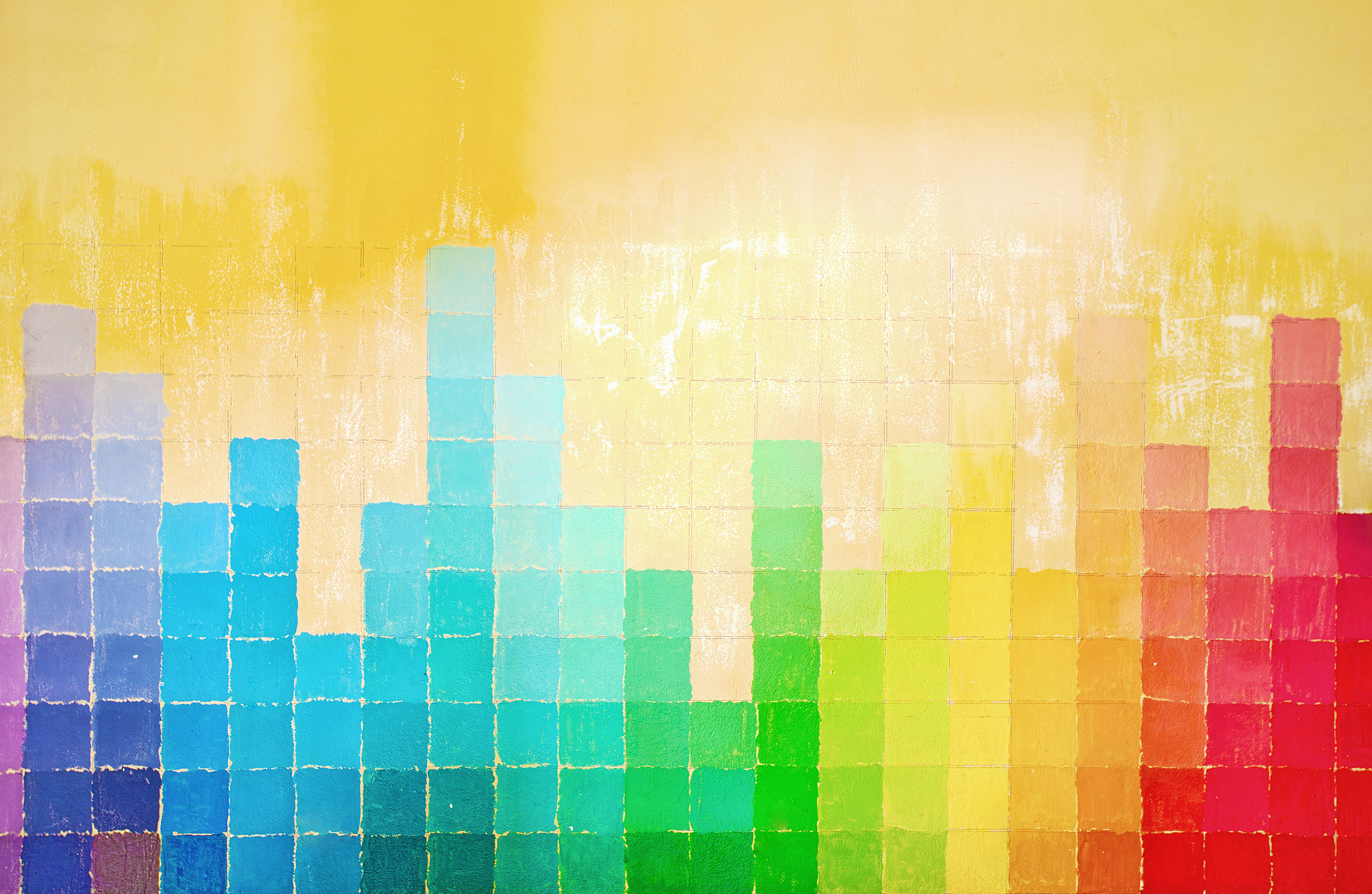 grunge wall painted in rainbow colors