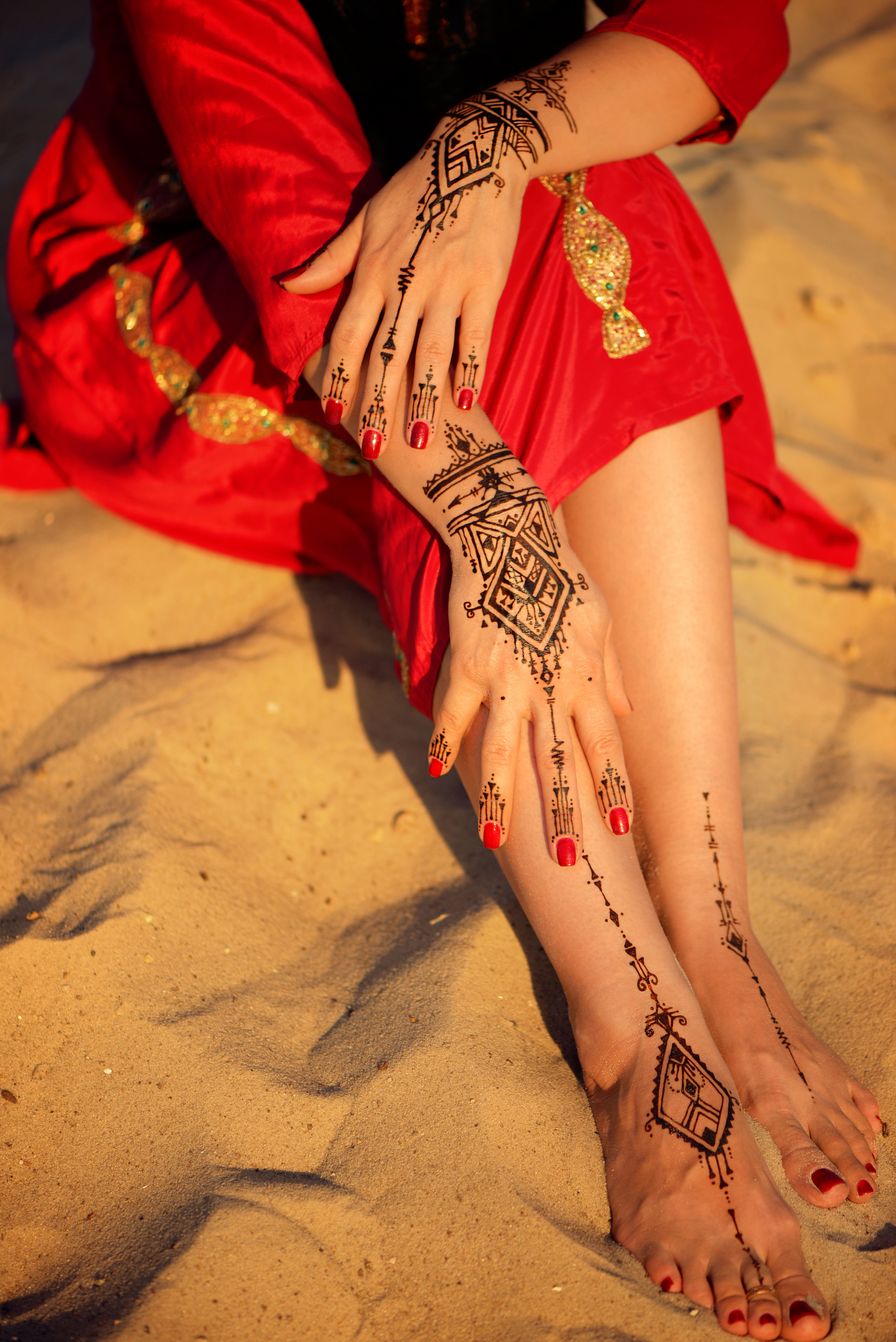 mehndi tattoo on beach sand background