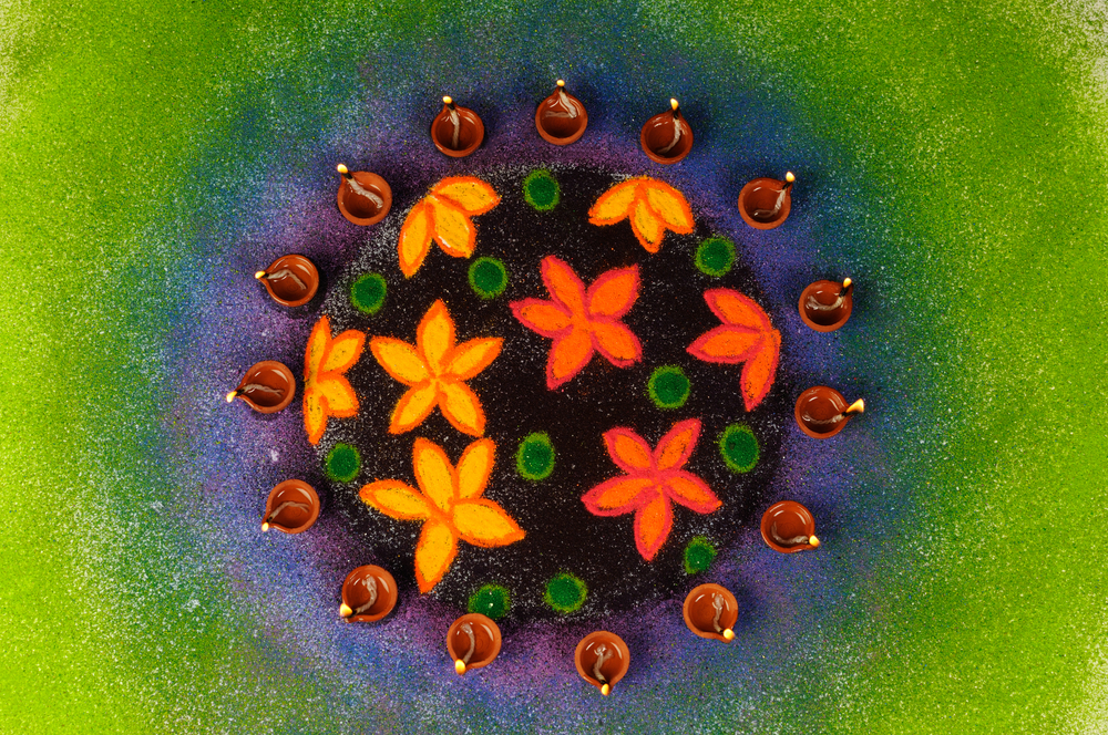 Decorated Diwali diya on rangoli