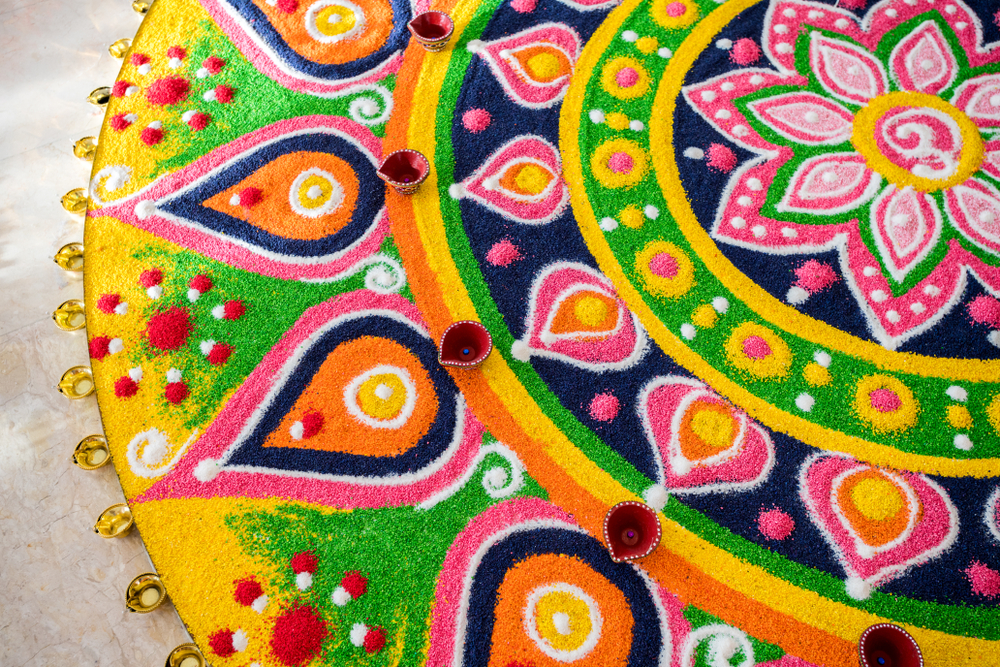 Rangoli made by multi coloured rice grains