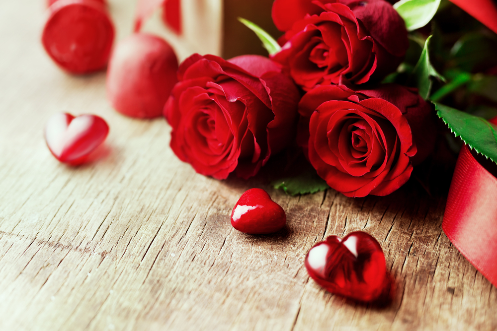 Roses and a hearts on wooden board