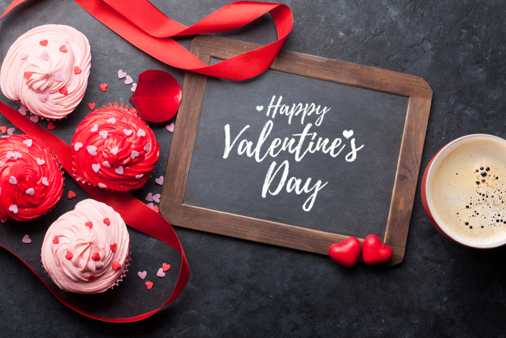 Valentine's day greeting card with delicious sweet cupcakes and coffee cup